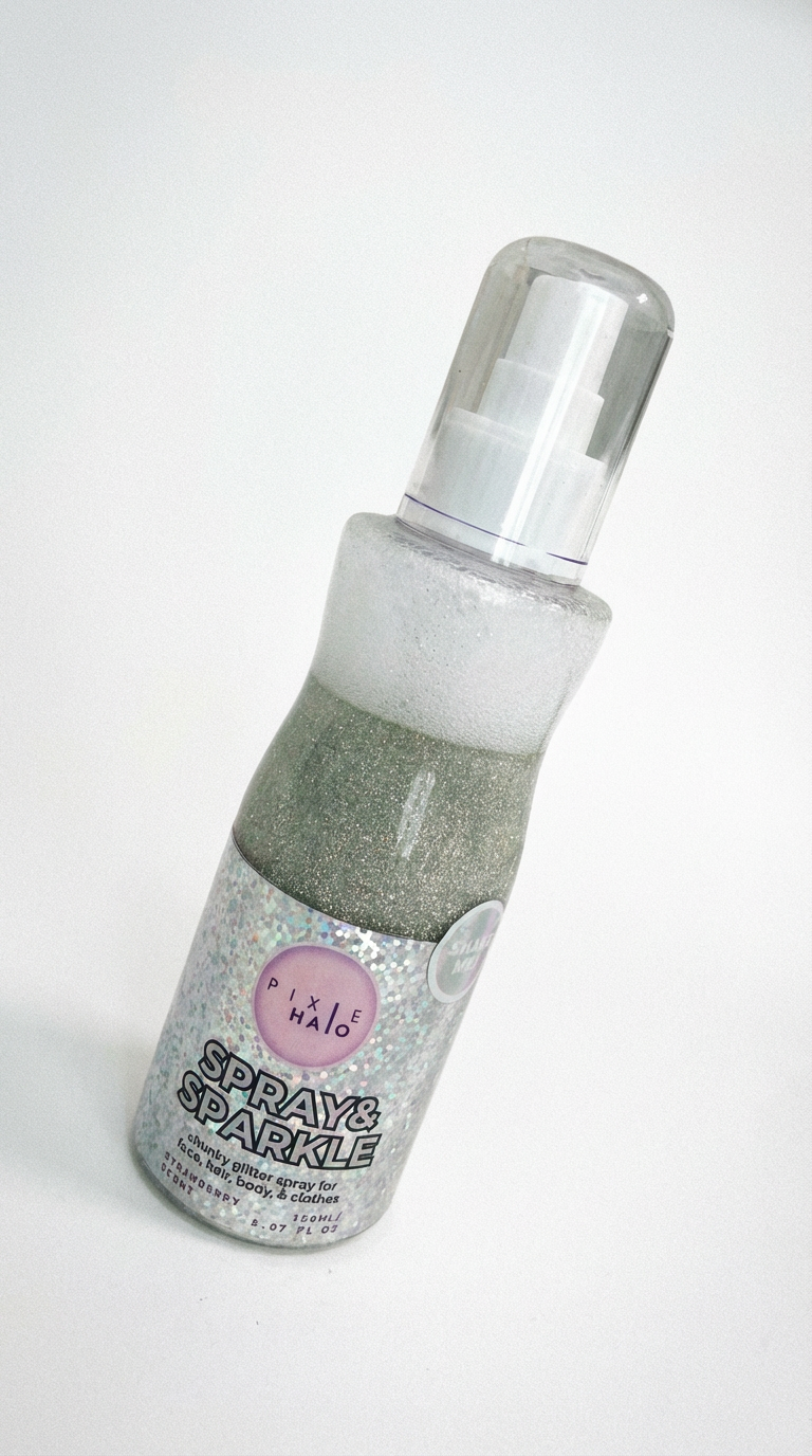 Glitter spray bottle angled on a white background showing the spray pump