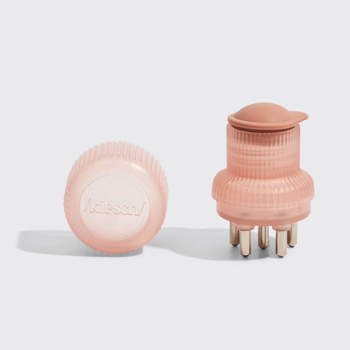 Terracotta scalp oil applicator shown with cap and with stainless steel tips exposed