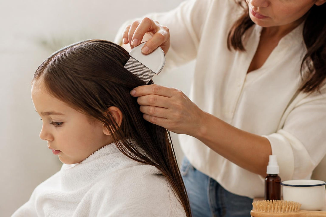 Parent wet combing child's hair for non-toxic lice treatment using conditioner and a metal nit comb The Pixie Garden