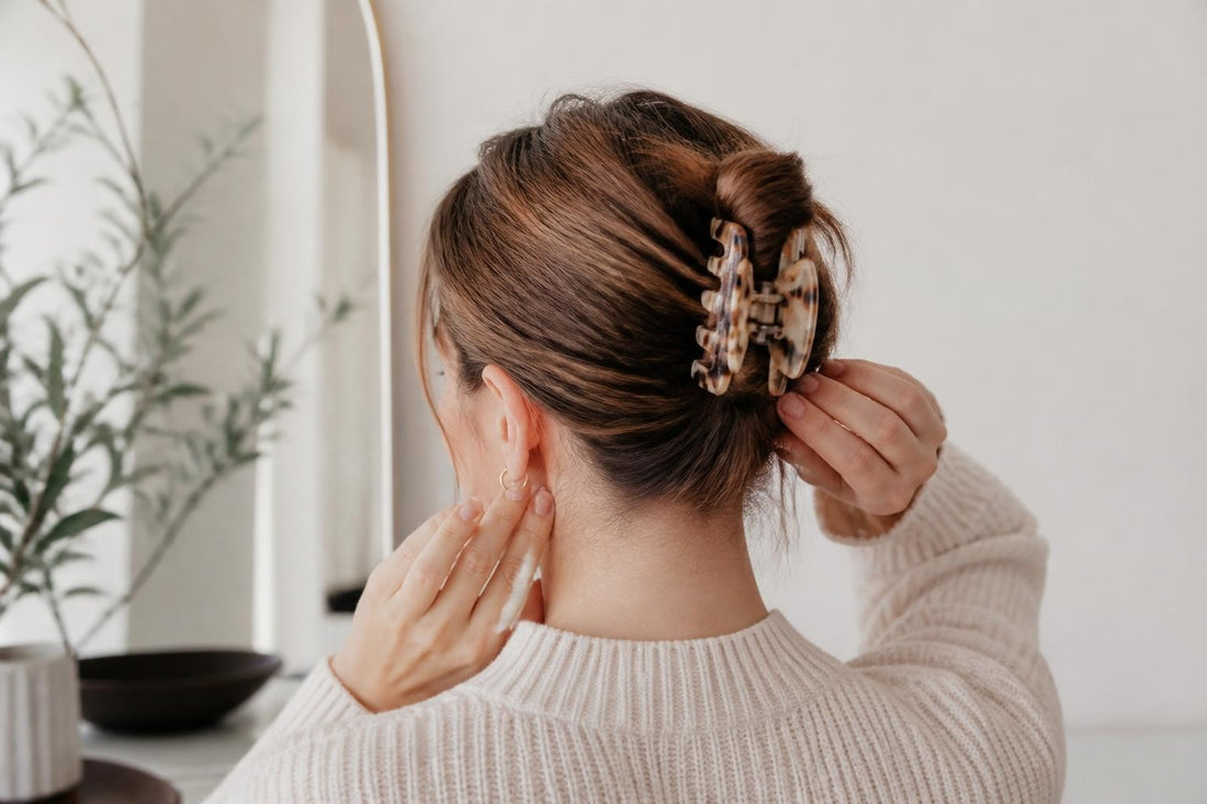 Licensed cosmetologist demonstrating the twist-and-clip method to secure claw clips for all-day hold The Pixie Garden