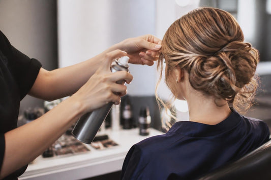 Elegant prom updo styled to last all night with salon finishing products by licensed cosmetologist The Pixie Garden