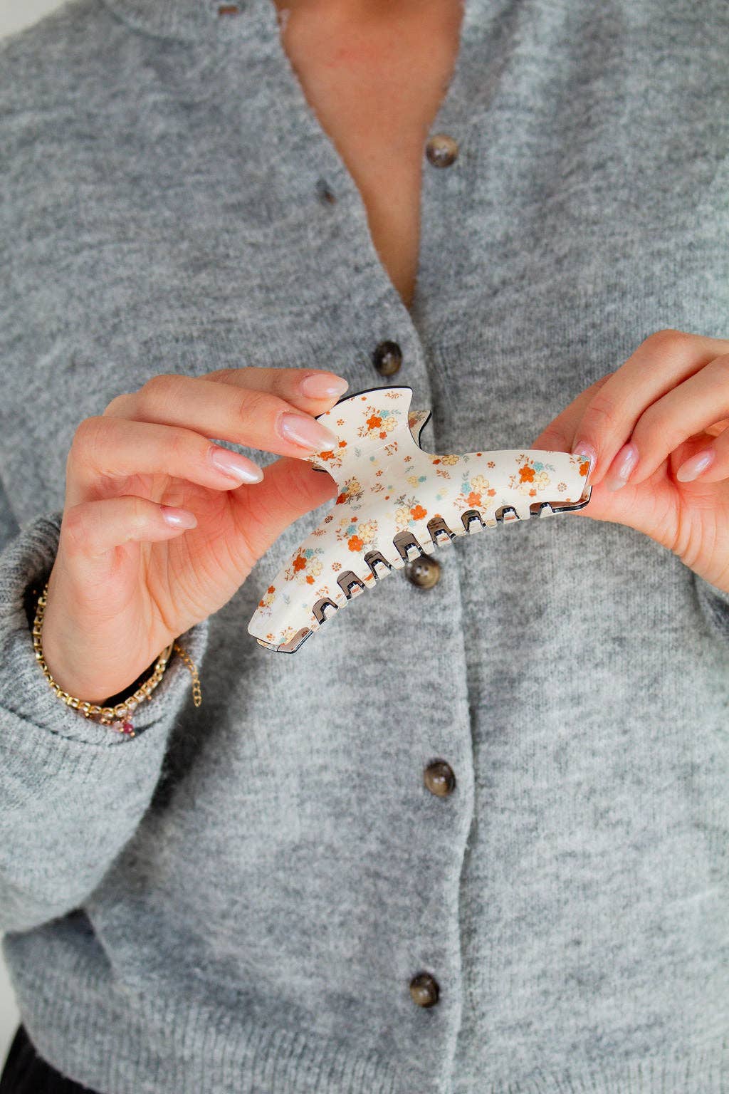 Antique floral claw clip held in hand product detail salon-selected The Pixie Garden