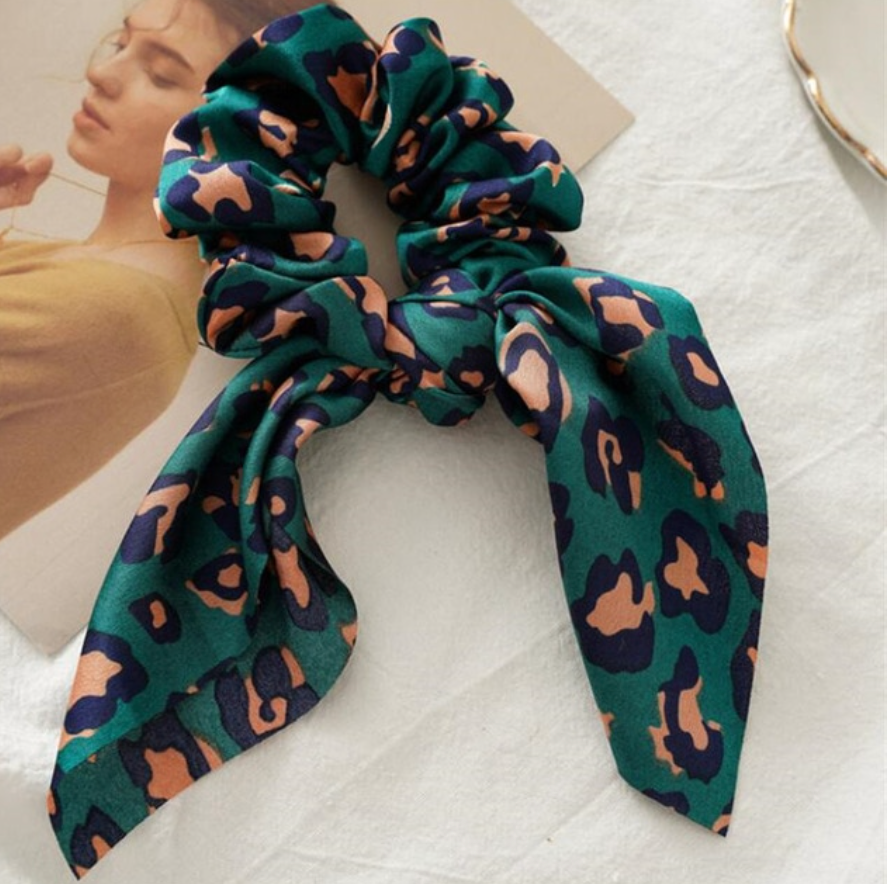 Leopard print scrunchie styled on ponytail polished finish The Pixie Garden