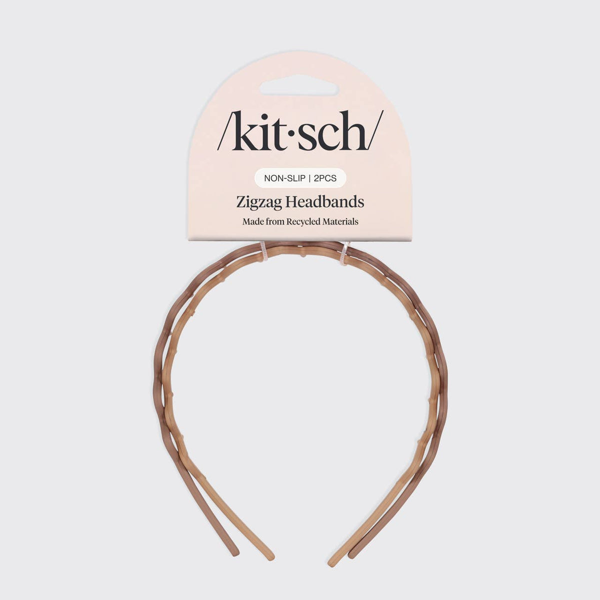 Tan zig zag headband mounted on its KITSCH packaging card