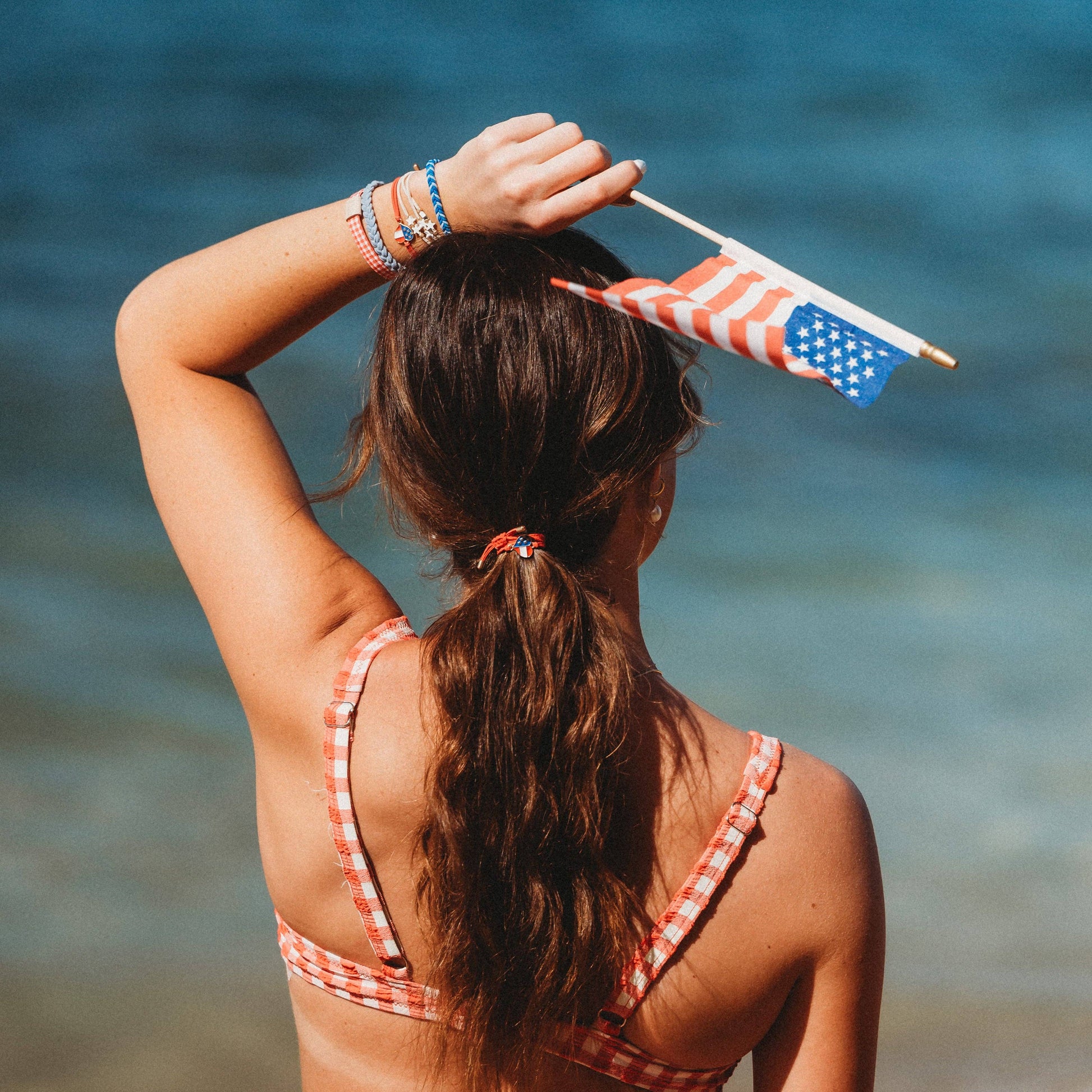 Free salon-selected patriotic gingham hair tie bracelets worn on the wrist The Pixie Garden
