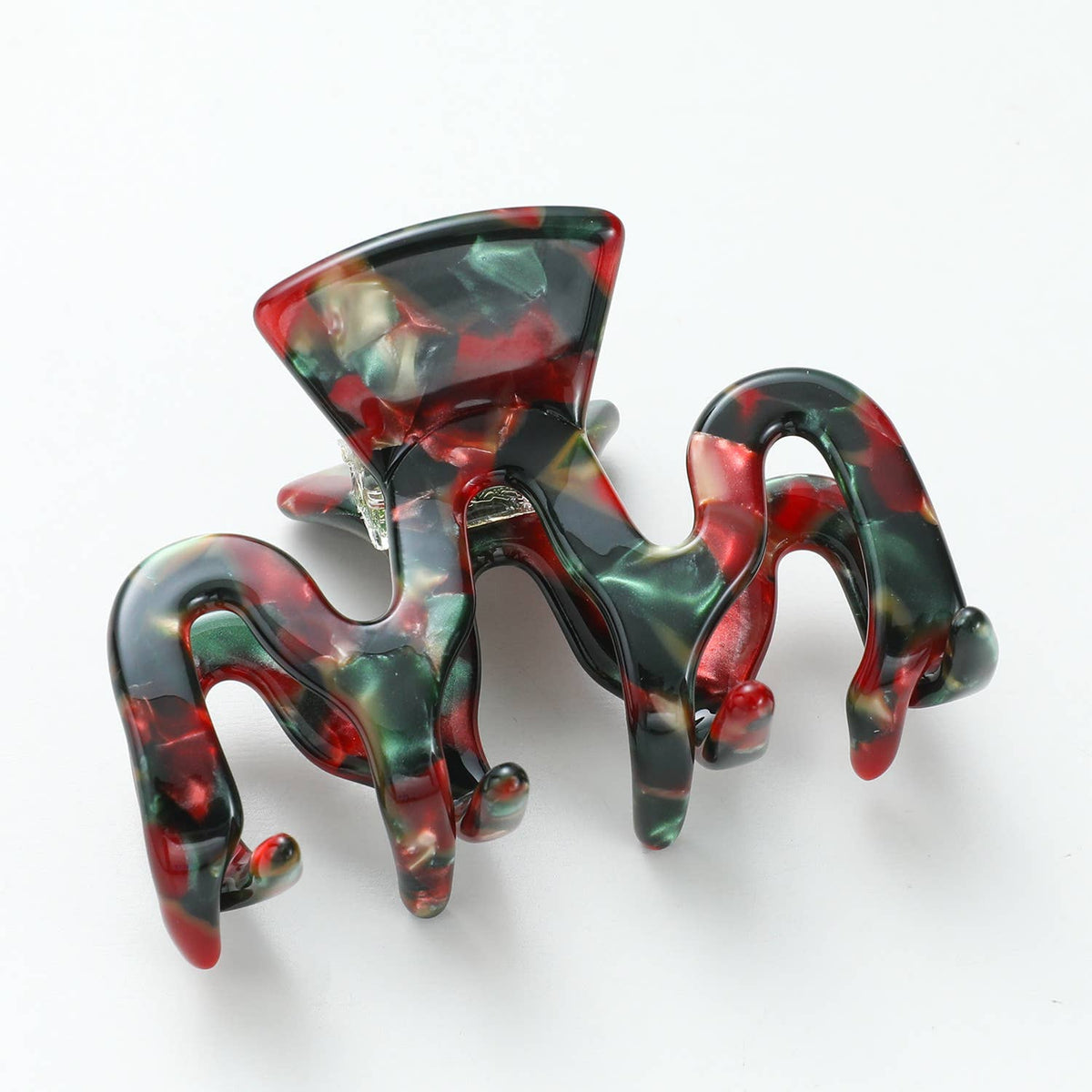 Small Vintage Christmas claw clip in marbled red and green acetate on a white background
