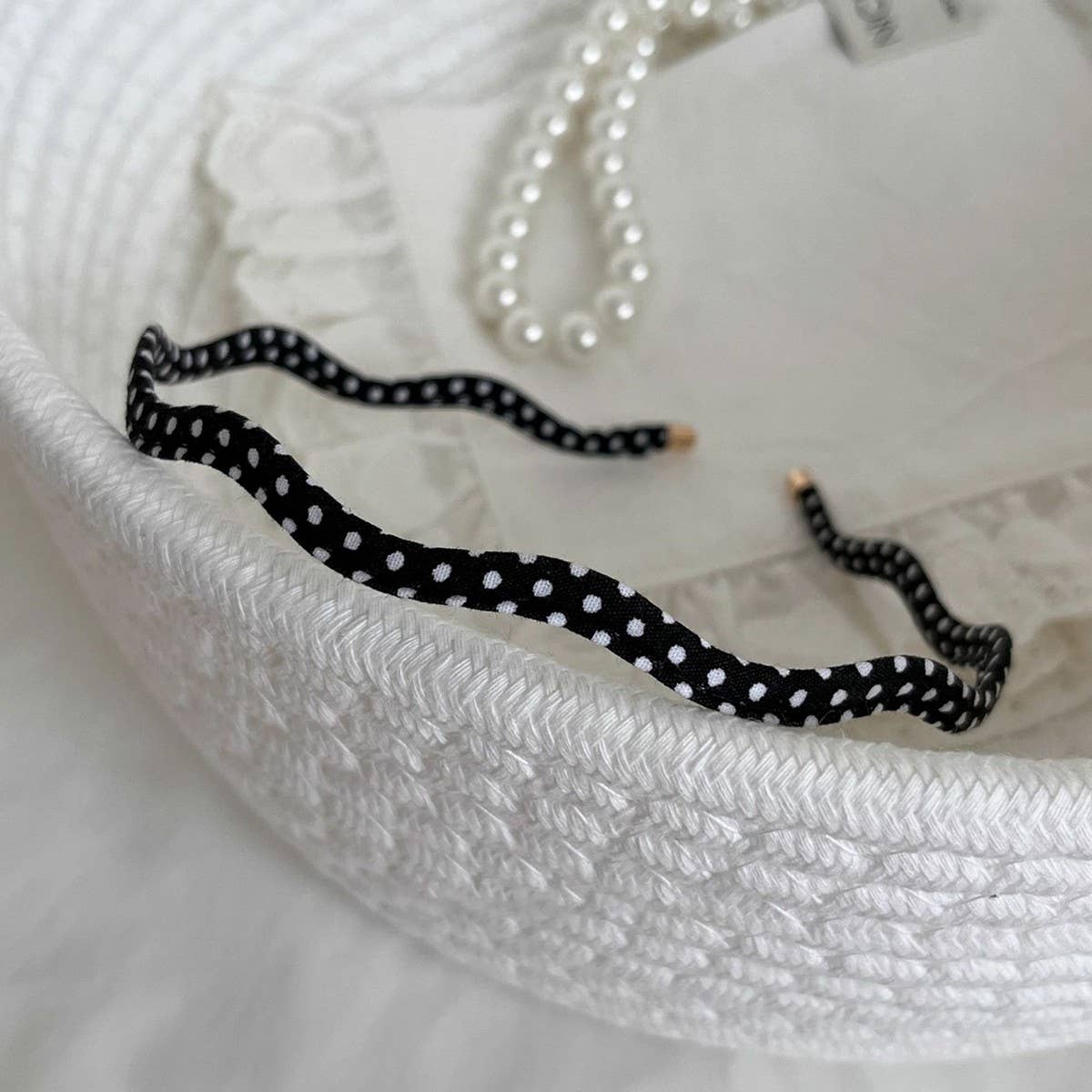 Beige polka dot wavy thin headband, flat lay, The Pixie Garden