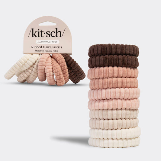 Stack of ribbed hair elastics with 'kit·sch' packaging on a white background