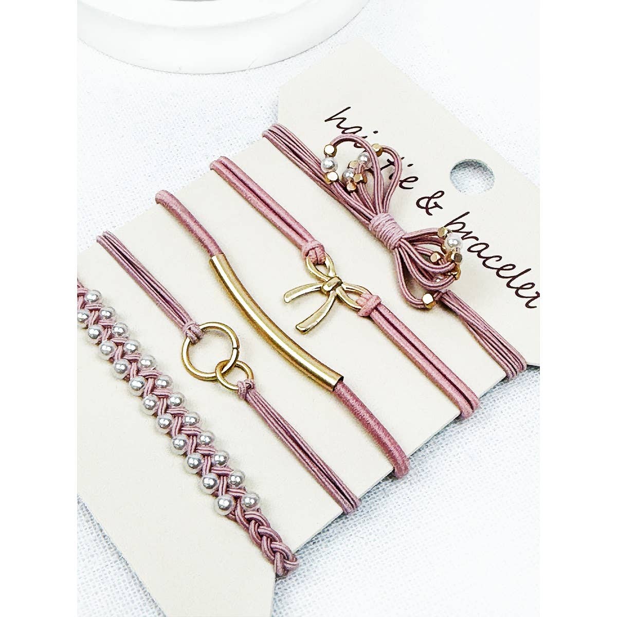 Dusty pink bow hair tie bracelets set on branded card | Boho stackable jewelry | Salon-Selected | The Pixie Garden