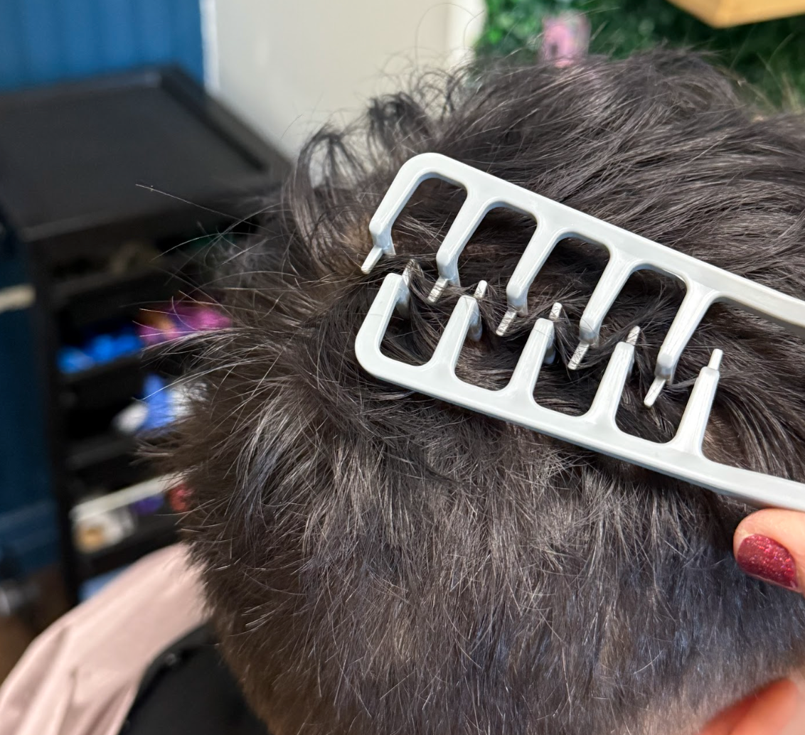 Close-up of Magic Texture Comb teeth lifting short hair at the root for fluffy volume