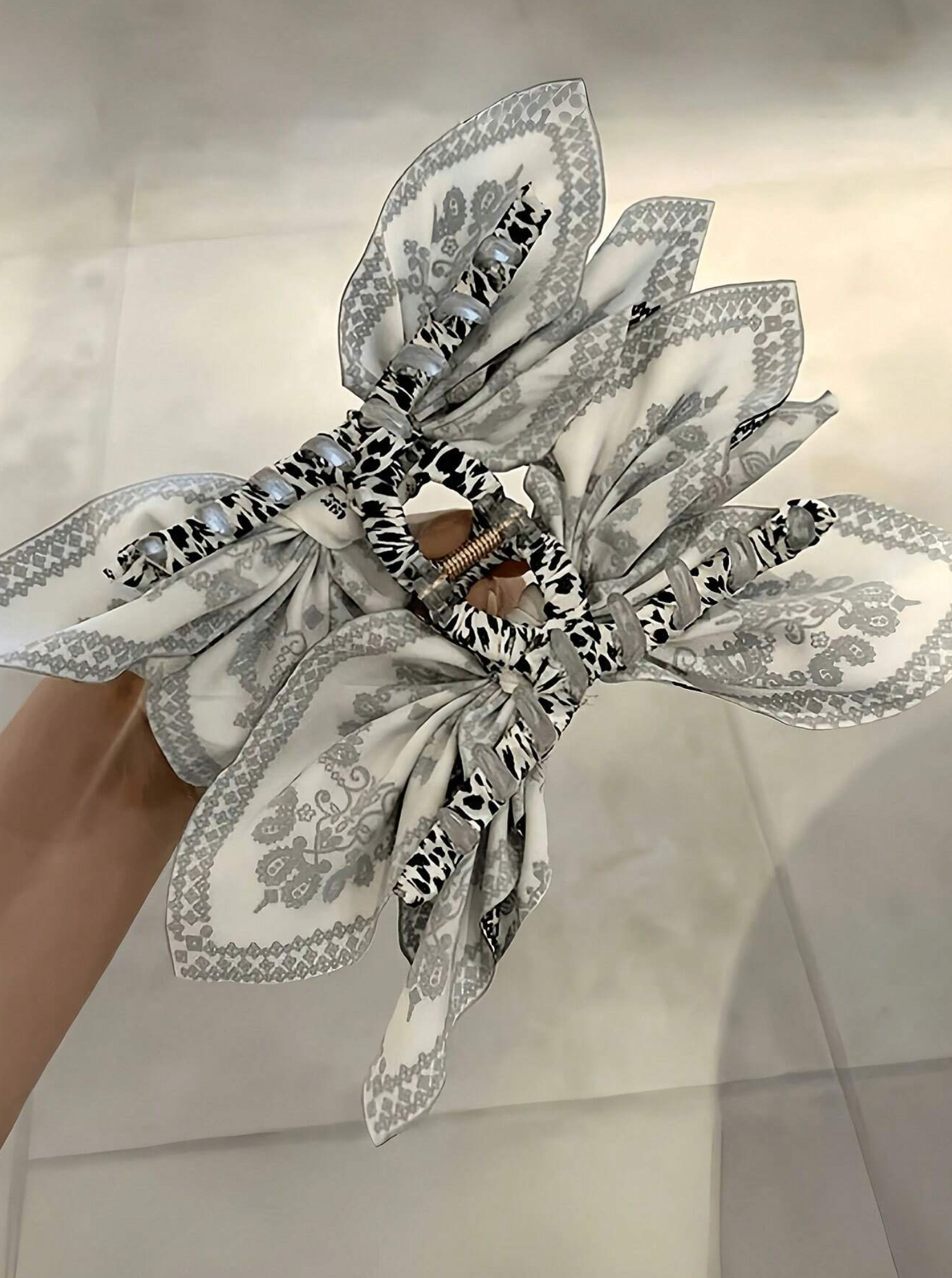 Black and white paisley bow hair clip multi-wing style The Pixie Garden