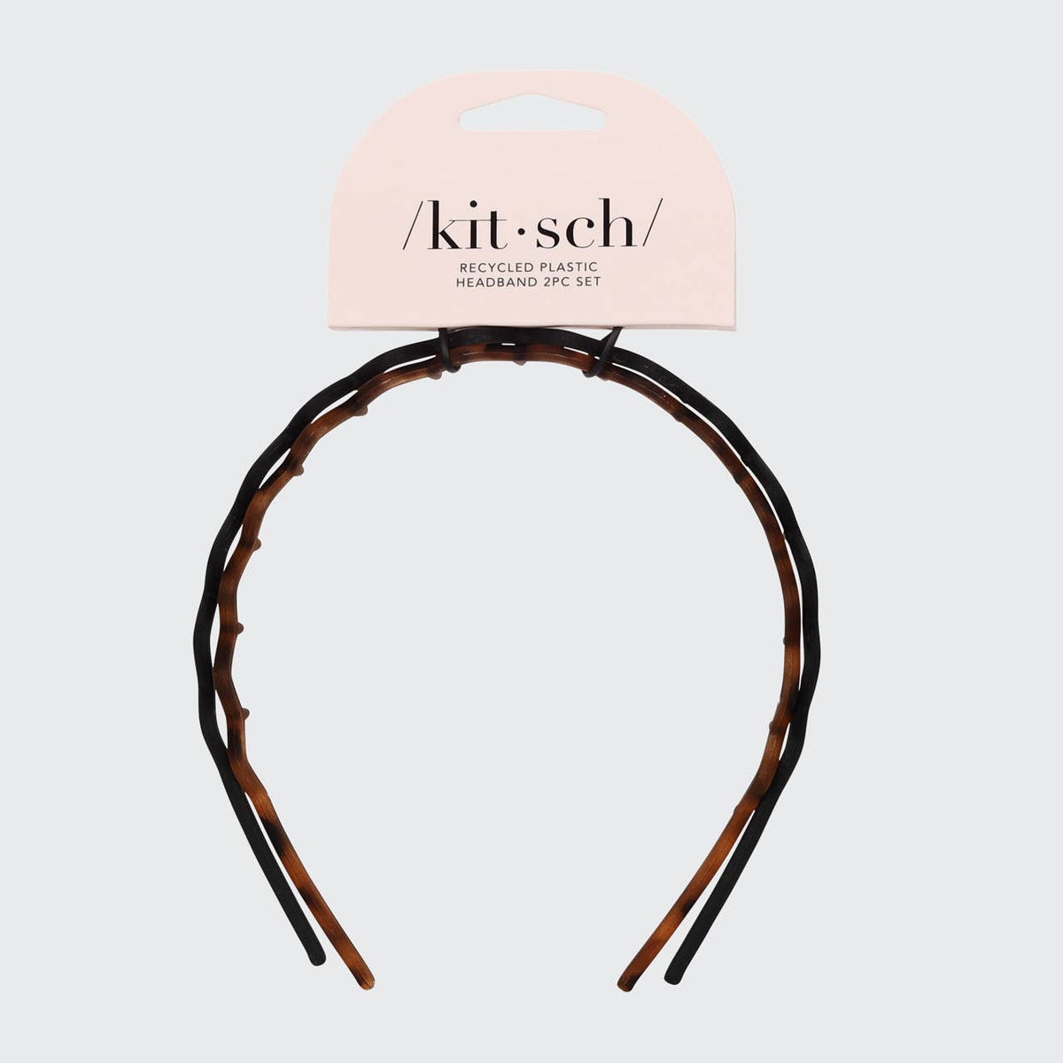 Tortoise zig zag headband mounted on its KITSCH packaging card
