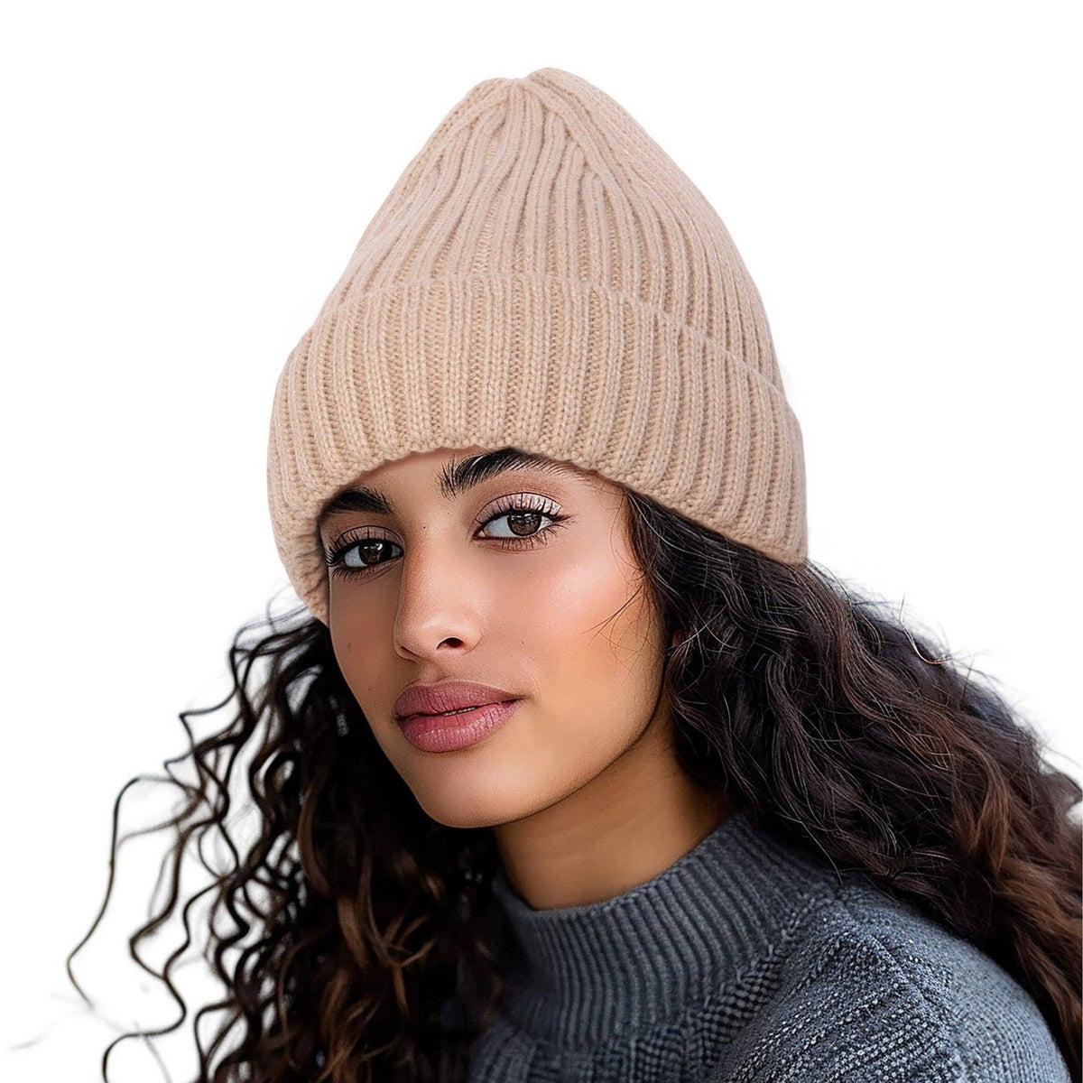 Woman with long curly hair wearing the khaki ribbed knit beanie