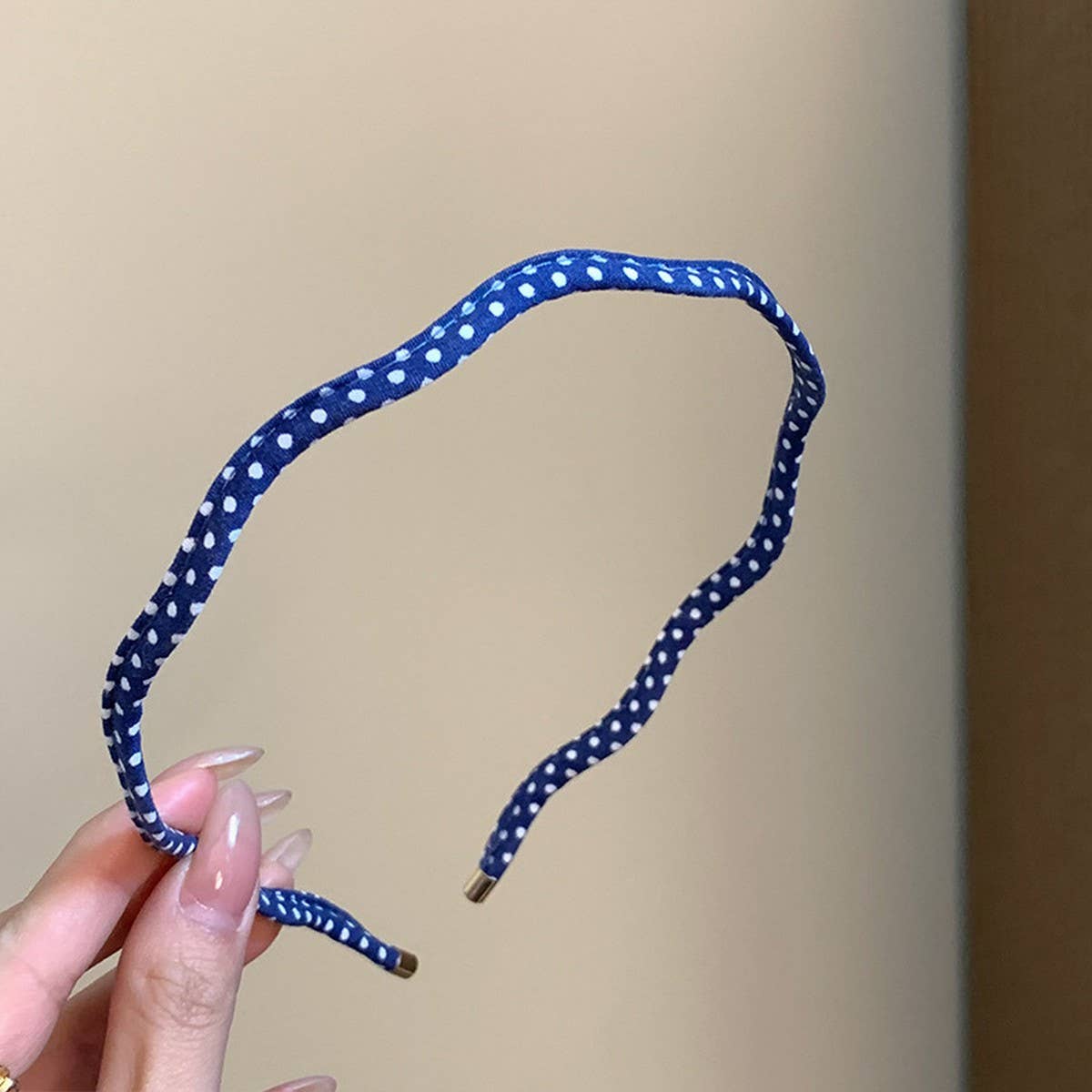 Beige polka dot wavy thin headband, close up, The Pixie Garden