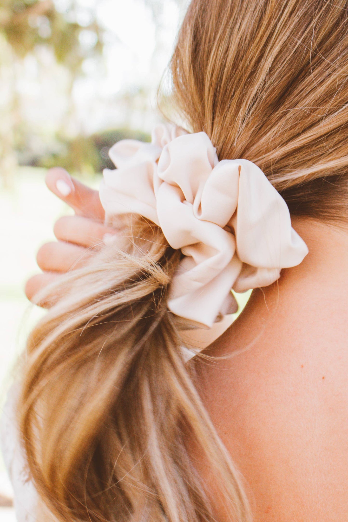 Oat milk jumbo scrunchie worn in hair salon-selected accessory lifestyle The Pixie Garden