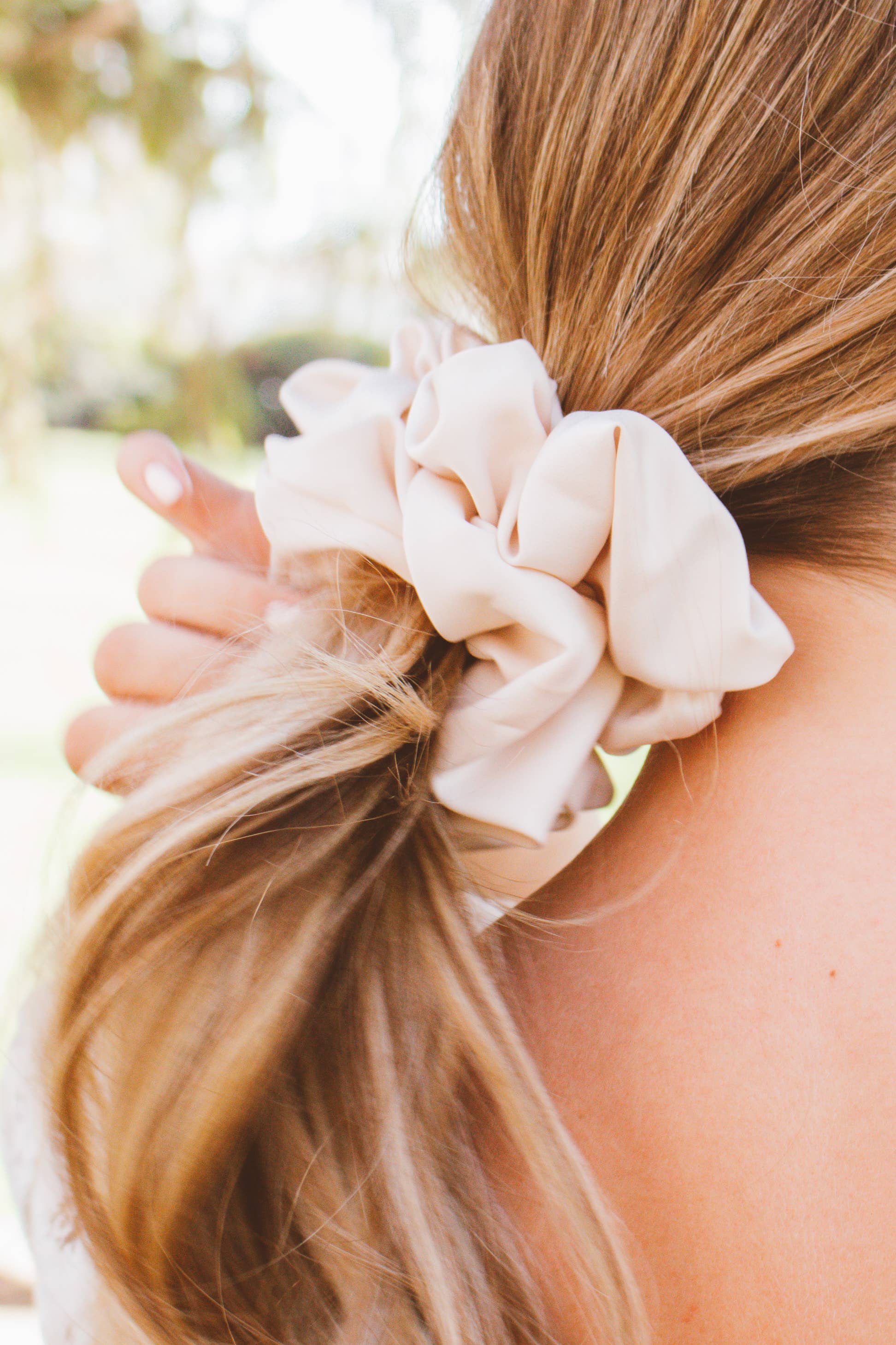 Oat milk jumbo scrunchie worn in hair salon-selected accessory lifestyle The Pixie Garden